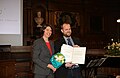 * Nomination Frau Prof. Dr. Thisbe Lindhorst and Prof. Dr. Felix-Raoul Fischer. --Alchemist-hp 17:07, 30 April 2016 (UTC) * Promotion Das Motiv hängt nach links und die Urkunde ist leicht überstrahlt. Außerdem würde ich das Bild enger zuschneiden. -- Spurzem 21:17, 30 April 2016 (UTC) Bild um 1,1° nach rechts gedreht. Engerer Zuschnitt? Nein, es soll gerade auch die Lacation zeigen! Urkunde überstrahlt, mag sein, aber bei solch dunklen Verhältnissen geht es nicht anders. --Alchemist-hp 21:32, 1 May 2016 (UTC) Für QI durchaus ausreichend. Bei Bildern, bei denen man nur ein Chance hat, ist der Maßstab ein anderer, als unter Laborbedingungen. --Steschke 21:11, 5 May 2016 (UTC)