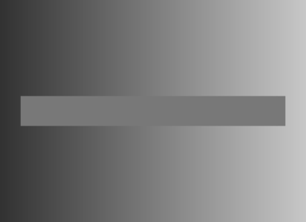 Simultaneous contrast illusion. The background is a color gradient and progresses from dark gray to light gray. The horizontal bar appears to progress from light grey to dark grey, but is in fact just one color.