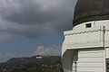 Western dome of Griffith Observatory with the Hollywood Sign in the distance