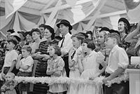 An audience watches a magician perform at the Louisiana State Fair in Donaldsonville (1938)