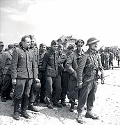 German forces surrendering to Canadian troops in Courseulles.