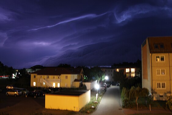 illuminated shelf cloud over Karlshagen, island Usedom in northeast Germany