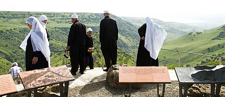 Israeli Druze family visitng Gamla; wearing religious dress.