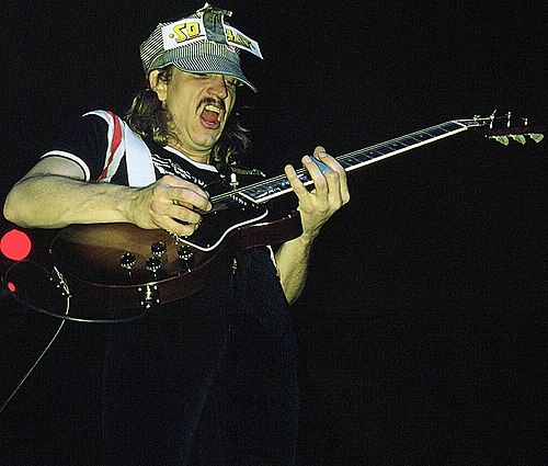Walsh playing slide guitar with a Gibson Les Paul Special, 1975