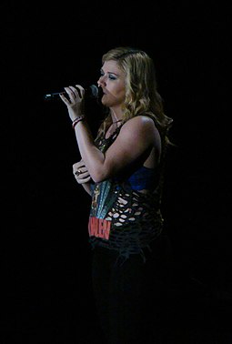 Kelly Clarkson (pictured in 2012) covered "Heavy in Your Arms" during her Stronger Tour. Kelly Live 2012 (2).jpg