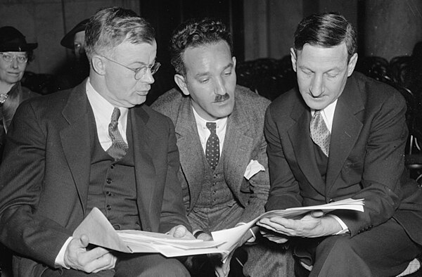 J. Warren Madden (left), Chair of the National Labor Relations Board (NLRB), is shown going over testimony with Fahy (right), General Counsel of the N