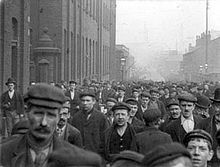 Outside a factory in Oldham. Marx believed that industrial workers (the proletariat) would rise up around the world. (Source: Wikimedia)