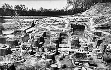 Pataliputra, capital of the Mauryas. Ruins of pillared hall at Kumrahar site. Mauryan ruins of pillared hall at Kumrahar site of Pataliputra ASIEC 1912-13.jpg
