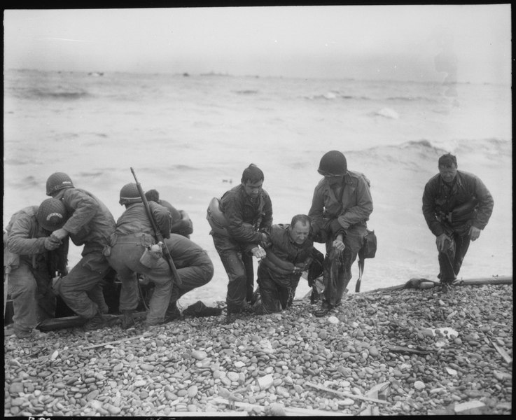 File:Members of an American landing party lend helping hands to others whose landing craft was sunk by enemy action off... - NARA - 531189.tif