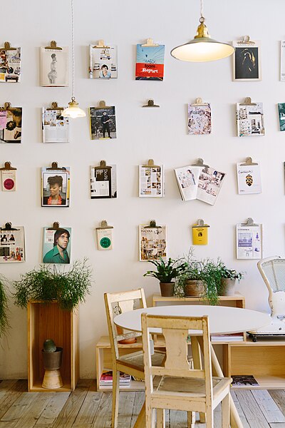File:Pictures on wall with table (Unsplash).jpg