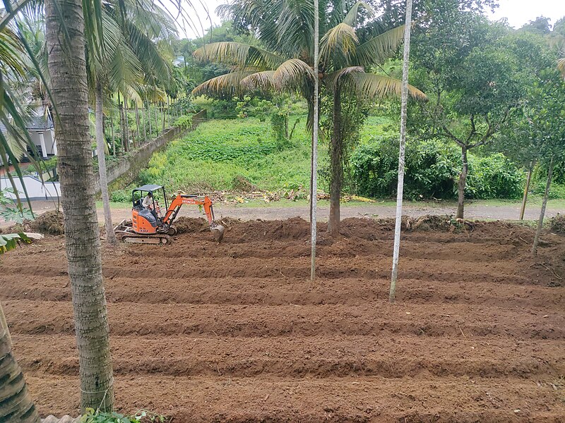 File:Plow land using an earth mover in Kerala, India IMG 20200715 132331.jpg