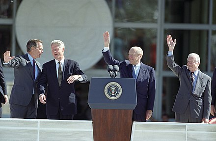 Ford joins President Bill Clinton and former presidents George H. W. Bush and Jimmy Carter on stage at the dedication of the George H.W. Bush Presidential Library and Museum at Texas A&M University, November 6, 1997