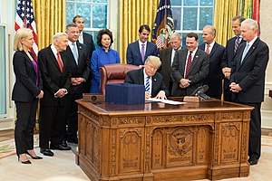 President Trump signing the FAA Reauthorization Act of 2018 into law. President Donald J. Trump signs H.R. 302, the FAA reauthorization Act of 2018 (45180323451).jpg