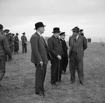 Lindemann, Churchill and Vice Admiral Phillips watching a demonstration at Holt, Norfolk