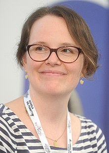 Raina Telgemeier stated that serializing a weekly webcomic on Girlamatic "[offered] just enough structure to finally tell a story" she had in mind for years. Raina Telgemeier - Lucca 2017.jpg