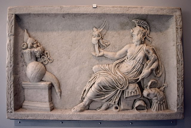 Defaced Dea Roma holding Victory and regarding an altar with a cornucopia and other offerings, copy of a relief panel from an altar or statue base
