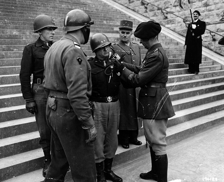 File:SC 196123 - Maj. Gen. Walton H. Walker, Commanding general 20th Corps, 3rd Army, is presented with the French Fouragere (Fourragère) by Major Paul Aubrey, commanding officer of the regular French Army, somewhere in France.jpg