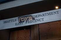 Seattle East Precinct Sign under Capitol Hill Autonomous Zone.jpg
