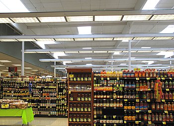 English: Shelves of packaged food inside a Ral...