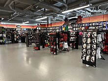 The interior of a Spirit Halloween location, showcasing various Halloween costumes and accessories for sale Spirit Halloween The Shops at Sunset Place, South Miami Florida August 2023.jpg