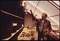 Steve Baer in a highly efficient greenhouse he built for a school in Albuquerque, New Mexico..., 04-1974 (7065964393).jpg