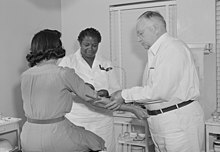 Administration of a Wassermann test at a clinic for Florida migratory farm workers in 1941. Taking a Wasserman blood test.jpg