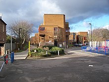 Trackbed of the former Palace Gates Line (left) and The Sandlings, built on the site of the former railway goods depot The Sandlings.JPG