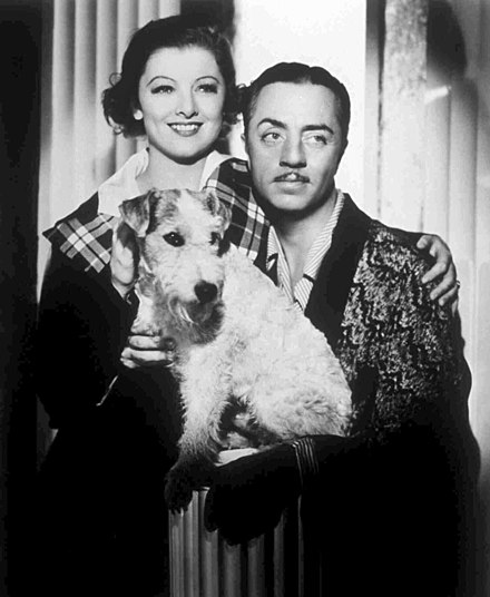 Powell with co-star Myrna Loy, along with Skippy as Asta, in a promotional photo for The Thin Man (1934)