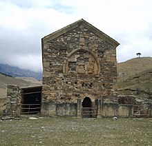 Ingush pre-Islamic beliefs. Temple Tkhabya-Yerd (temple of 2000) was initially a cuboid cyclopean masonry structure, which was rebuilt during the spread of Christianity in Ingushetia. The rebuilt wall was done with smaller stones shown at the entrance side. Tkhaba-Erdy.jpeg