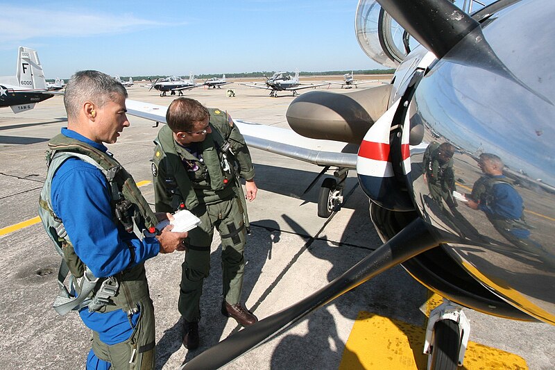 File:US Navy 091104-N-9001B-052 NASA astronaut candidate Lt. Col. Mark Vande Hei and Lt. Cmdr. Patrick McCaslin, an instructor with Training Squadron (VT) 4, conduct a preflight check of the cockpit of a T-6A Texan II.jpg