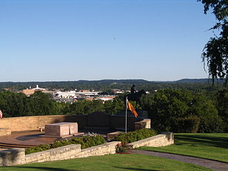 The modern Cherokee Nation flag displayed at the tomb of Will Rogers in Claremore View of Claremore with Rogers Tomb.jpg