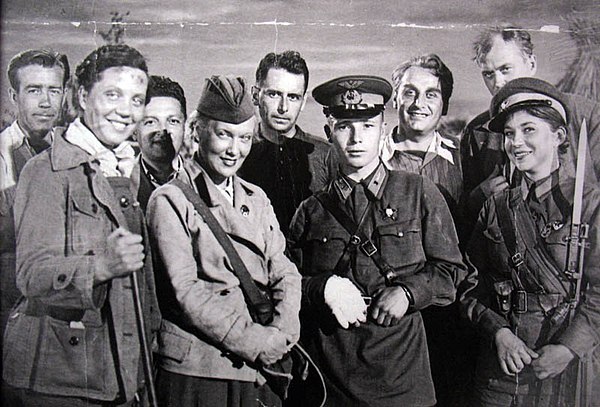 Aleksandrov (second row, 2nd from the right) and his wife Orlova (with a postbag) in Moscow during the shooting of Fighting Film Collection #4 in Augu