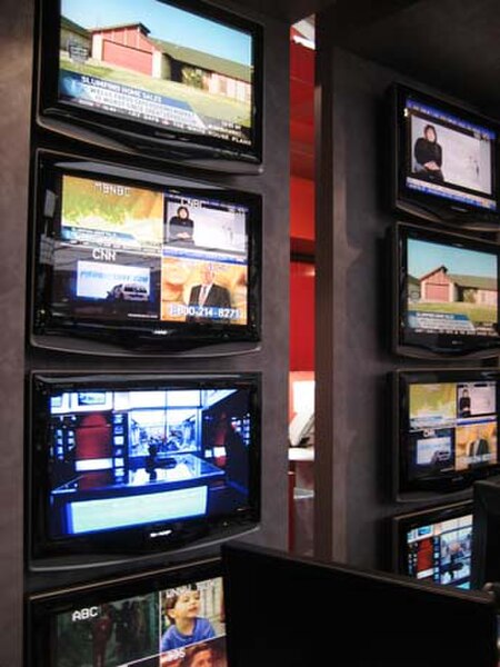 The monitors of the MSNBC newsroom are tuned into various global channels.