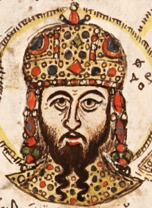 Head of a bearded man wearing a crown.