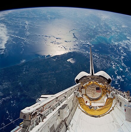 Atlantis passes over Florida. SHARE-II is prominent on the left.