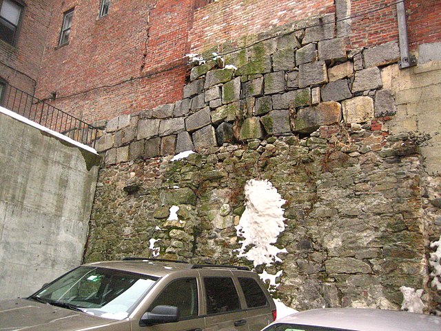 This wall in Beacon Hill, Boston shows different types of brickwork and stone foundations.