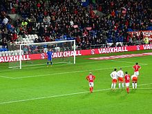 Williams (wearing No.13) watching a Welsh penalty kick against the Netherlands in 2015. 20151113 WAL NED Cillessen 2.jpg