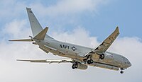 A Boeing P-8 Poseidon, tail number 168996, on final approach at Kadena Air Base in Okinawa, Japan. It has an AN/APS-154 Advanced Airborne Sensor (AAS) mounted underneath it.