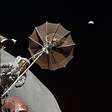 Harrison H. Schmitt, an astronaut in the Apollo 17 mission, with the Moon and Earth in the background AS17-134-20473.jpg
