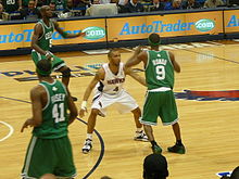Law guards Rajon Rondo of the Boston Celtics in the 2008 NBA Playoffs. Acie Law Rajon Rondo.jpg