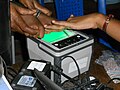 Taking fingerprints for Aadhaar,a 12-digit unique number which the Unique Identification Authority of India (UIDAI) will issue for all residents in India.The number will be stored in a centralized database and linked to the basic demographics and biometric information – photograph, ten fingerprints and iris of each individual.