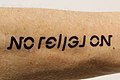 Ambigram tattoo No religion.jpg