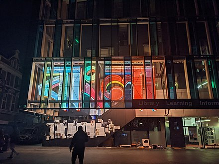 The Whitechapel Library with the word "বাংলা" illuminated in its front.