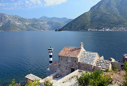 The bay of Kotor viewed from Lepetani's road, in Montenegro. In the background, on the right, the town of Perast. In the foreground, the church Gospe od anđela (Our Lady of Angels).