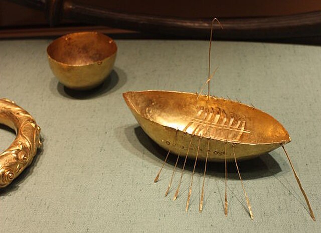 The boat, bowl, and part of the torc