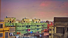 A PDRC installed on a roof in Kolkata exhibited a nearly 4.9 degC (8.8 degF) decrease in surface ground temperatures (with an average reduction of 2.2 degC or 4.0 degF). Buildings in Kolkata.jpg