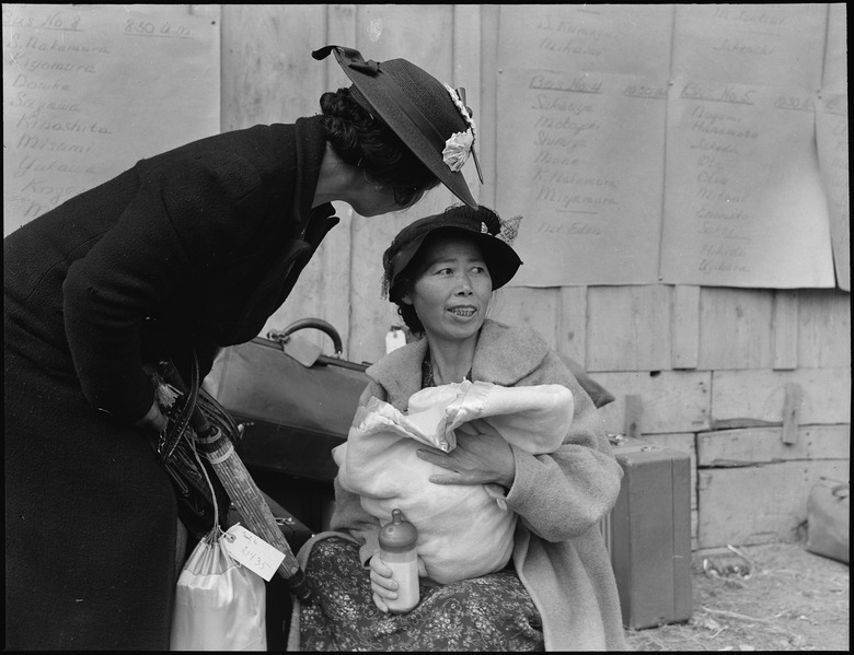 File:Centerville, California. Mother and baby await evacuation bus. Posted on wall are schedules listin . . . - NARA - 537581.tif