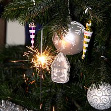 A sparkler on a Christmas tree Christmas baubles and sparkler (02).jpg