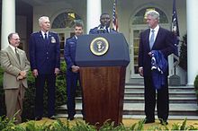 Charlie Jackson giving a White House Rose Garden presentation to United States President, Bill Clinton, on May 9, 2000. Coach Charlie Jackson and President Bill Clinton.jpg