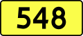 English: Sign of DW 548 with oficial font Drogowskaz and adequate dimensions.